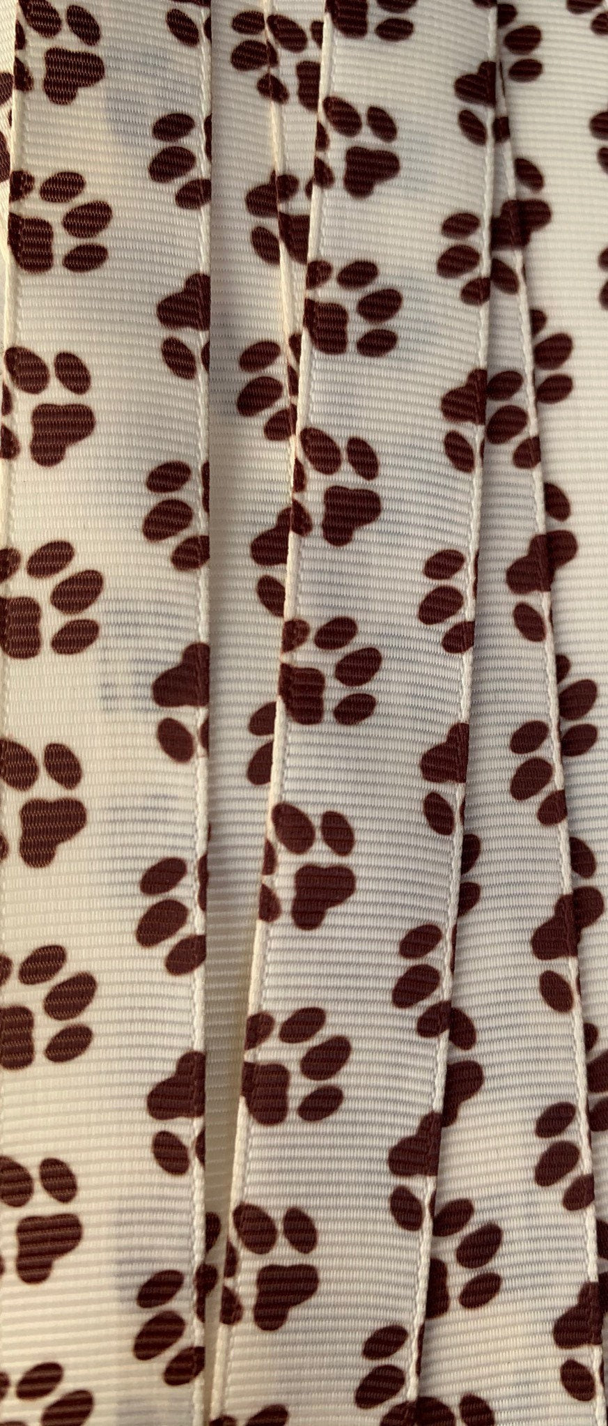 Puppy dog paws brown 5 yards on Ivory 5/8” grosgrain ribbon * TWRH limited stock.